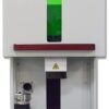 A green light is on the front of a machine.